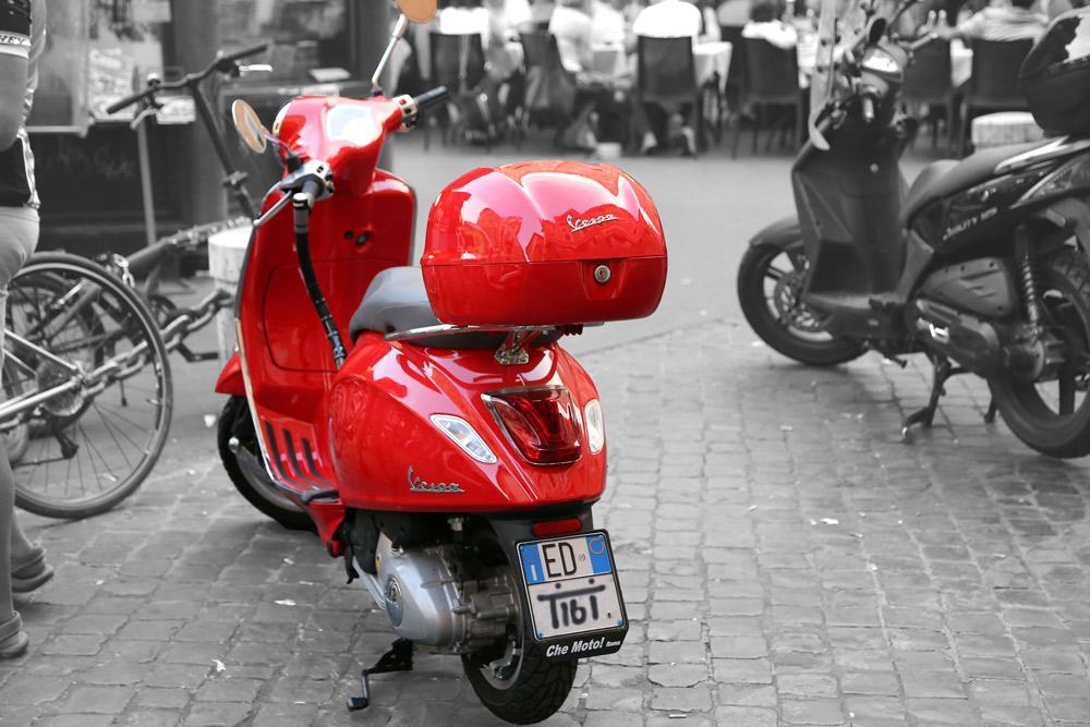 Red Vespa in Rome on black and white.