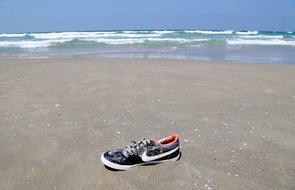Shoe on the beach of Haifa Israel