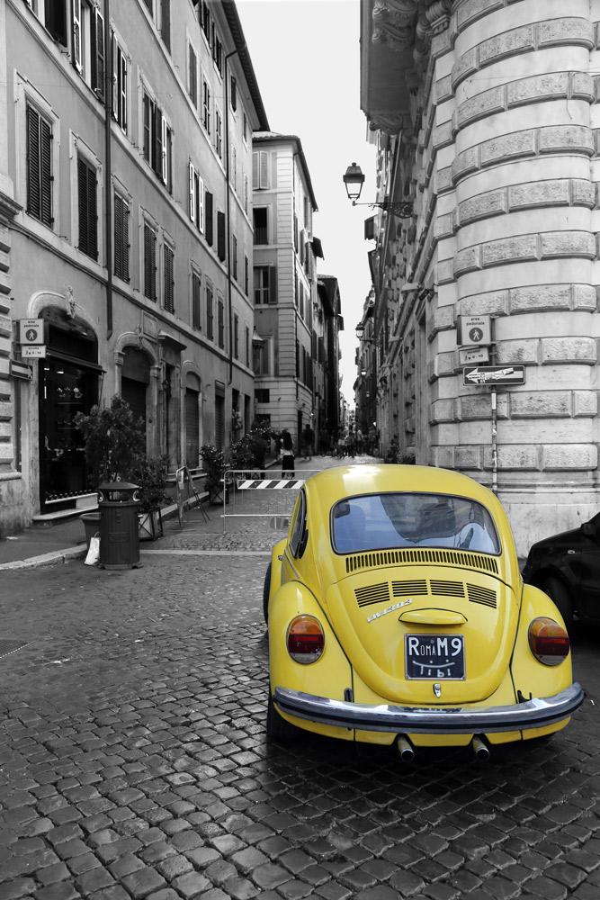 Yellow Beatle in Rome on black and white.